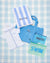 Three personalized mesh pouches: a pink pouch, a white pouch and a blue pouch.