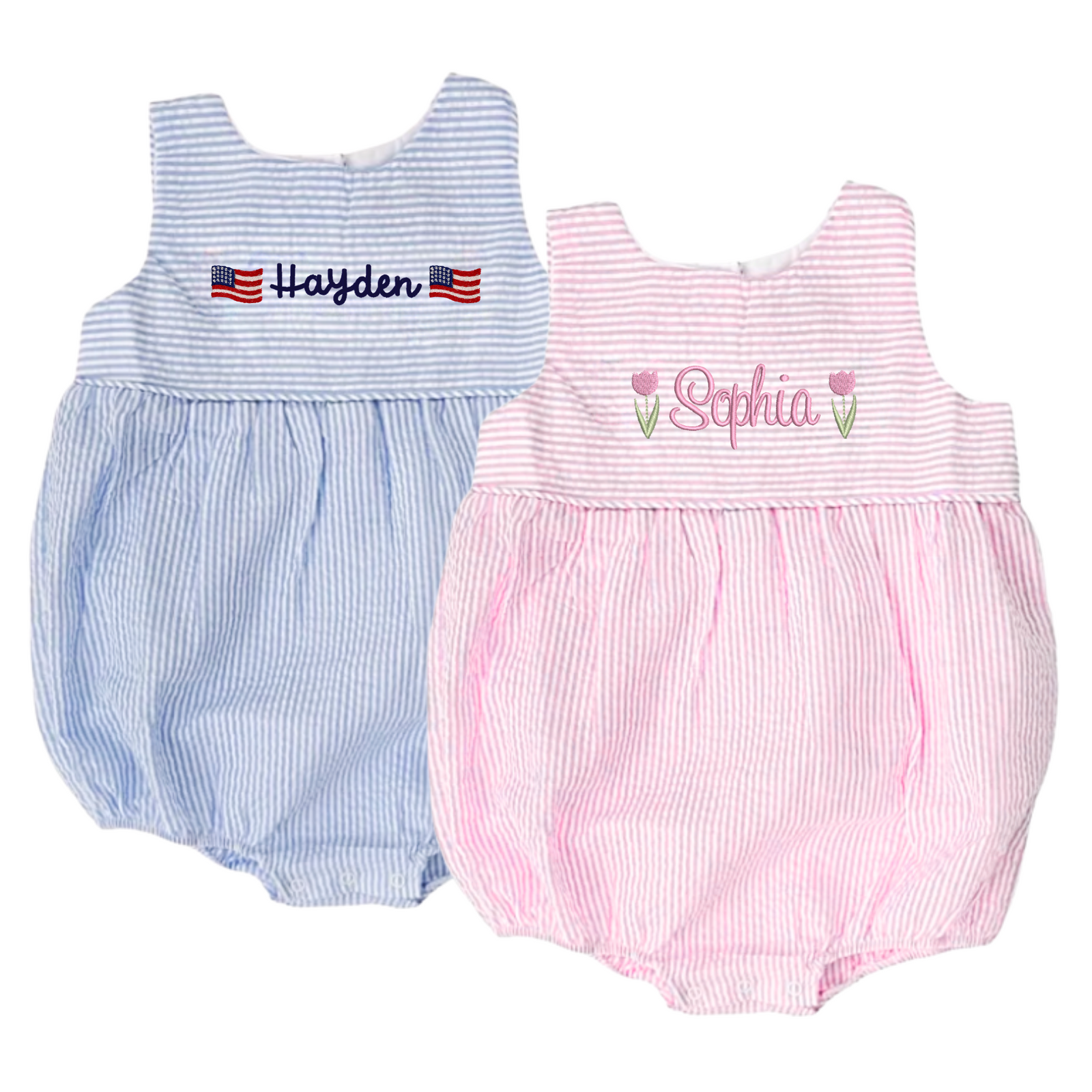 Two personalized baby seersucker bubbles are shown side by side—one in blue and white stripes with the name "Hayden" embroidered between two American flags, and the other in pink and white stripes with the name "Sophia" embroidered between two pink tulip motifs. These Seersucker Bubbles with Motif feature a classic sleeveless silhouette, soft gathers at the waist, and custom embroidery for a timeless, preppy look.