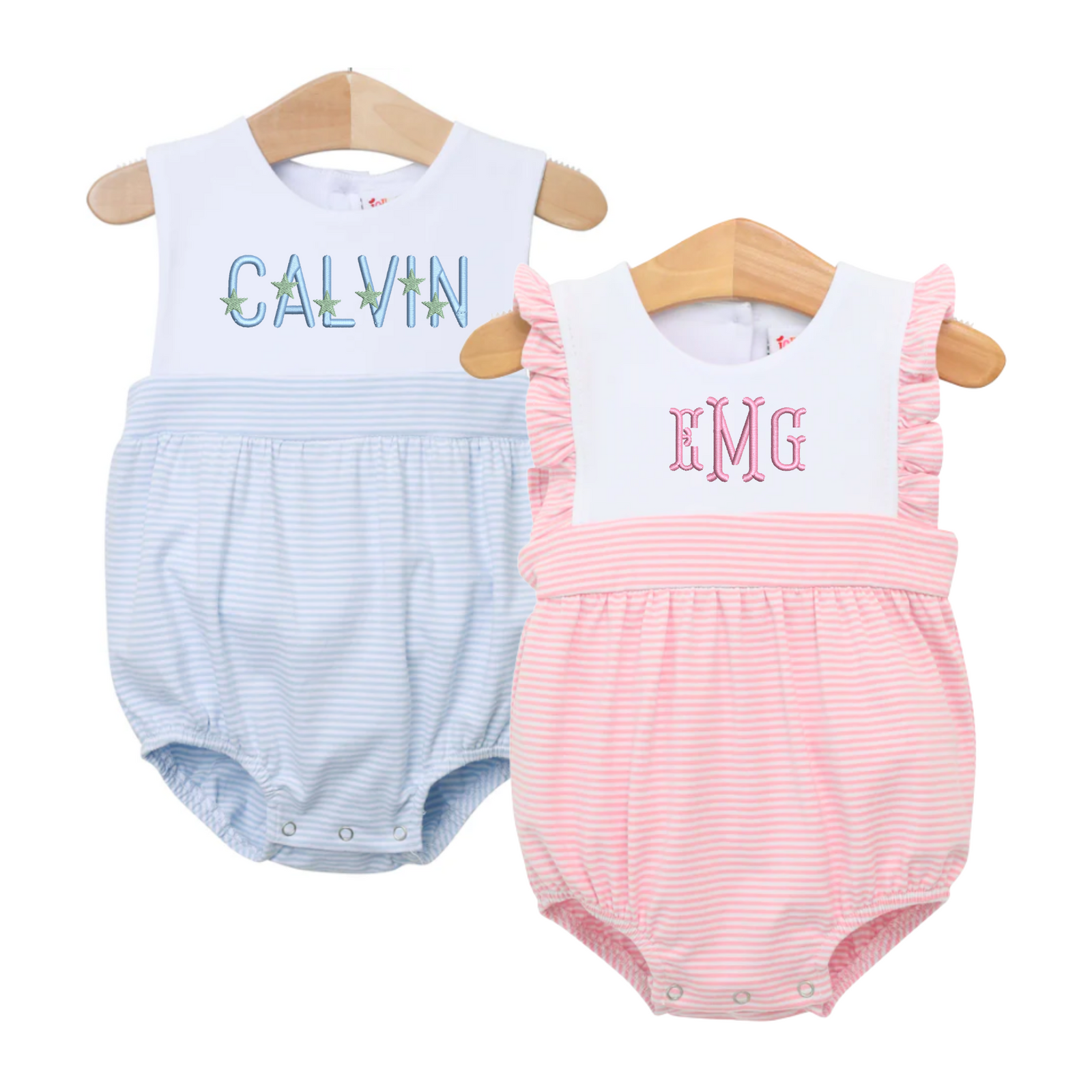 Two sleeveless striped bubbles for babies are displayed on wooden hangers—one in light blue with the name "Calvin" embroidered in playful green starfish lettering, and the other in light pink with ruffle sleeves and monogram "EMG" in a classic font. These Sleeveless Striped Bubbles feature soft horizontal pinstripes, snap closures at the bottom, and personalized embroidery, perfect for summer days or special occasions.