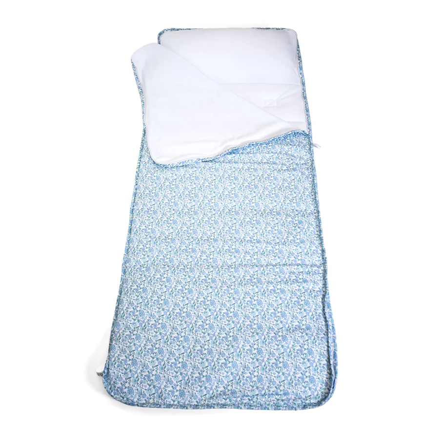 Floral-patterned Nap Mat in soft blue and white tones, featuring a built-in pillow and cozy interior blanket—perfect for preschool, daycare, or travel naps. This all-in-one mat offers comfort and convenience for little ones on the go.