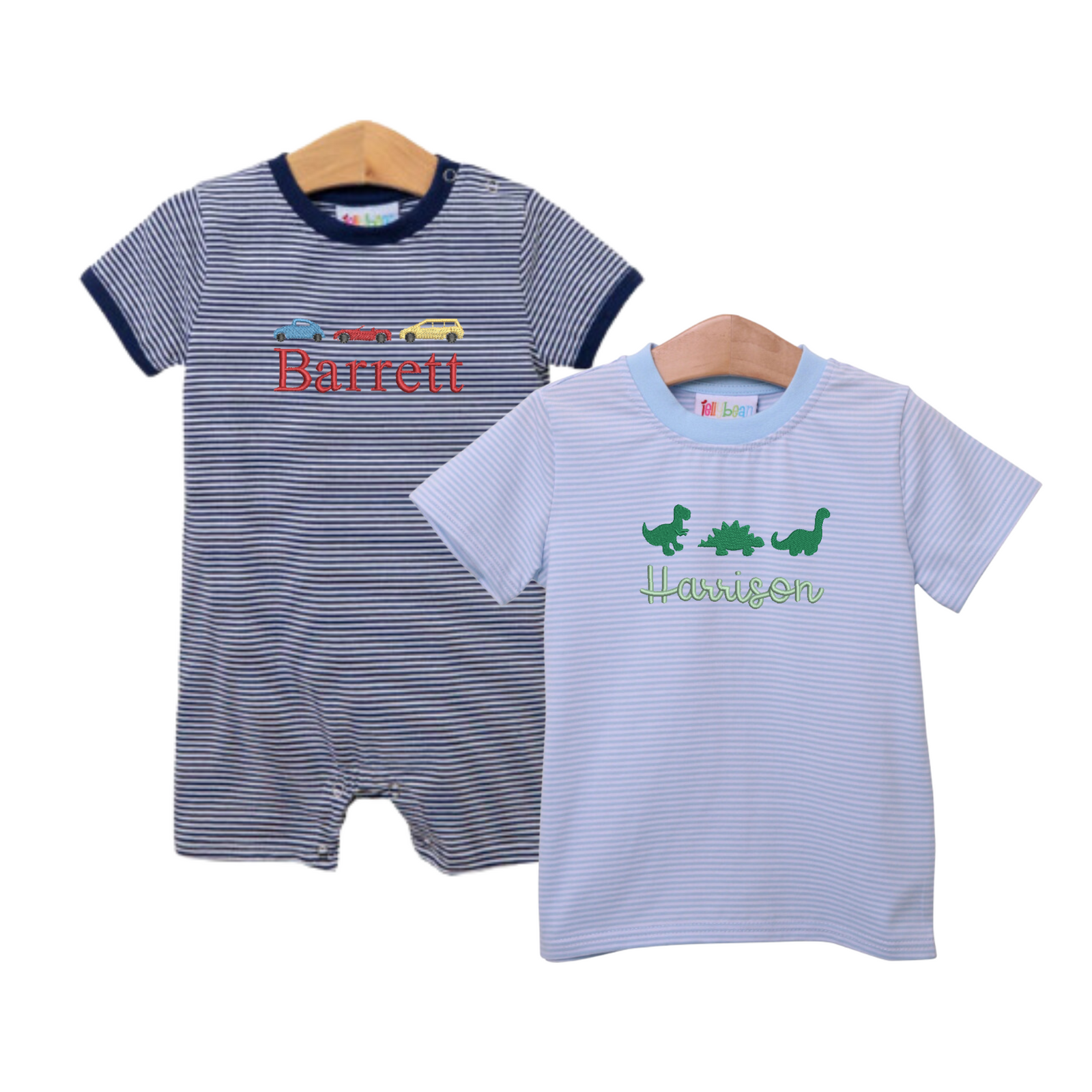 Striped Short Sleeve Romper & T-Shirt with Full Chest Motif from Rainey Laine, featuring a navy romper with colorful race car motif and personalized name 'Barrett' in red embroidery, paired with a light blue striped t-shirt with green dinosaur motif and embroidered name 'Harrison,' both displayed on wooden hangers.