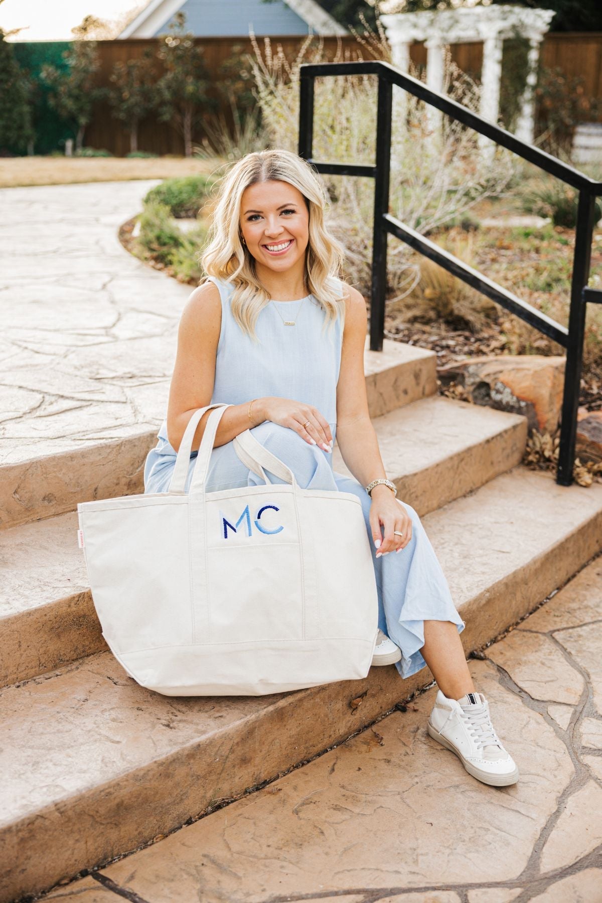 Large cream canvas tote bag with blue 'MC' monogram