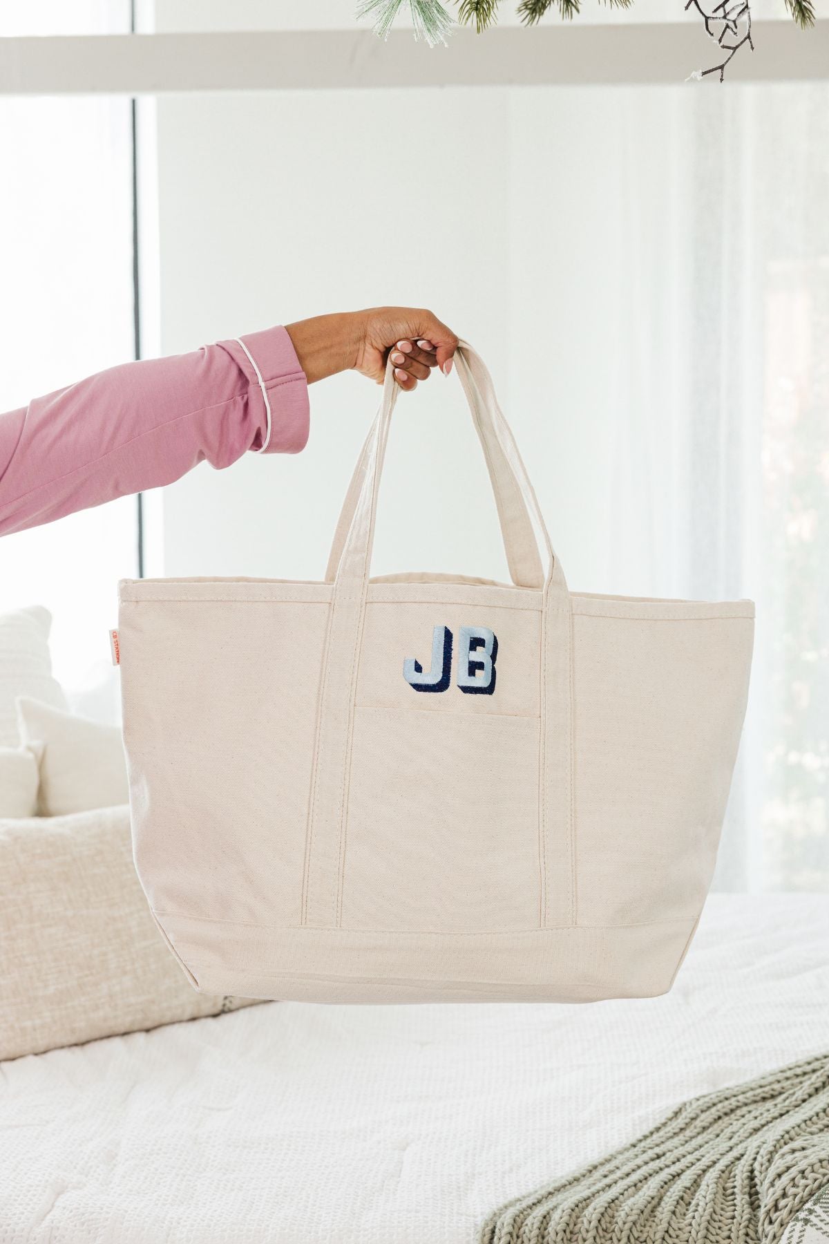 Cream canvas tote bag with 'JB' monogram in blue