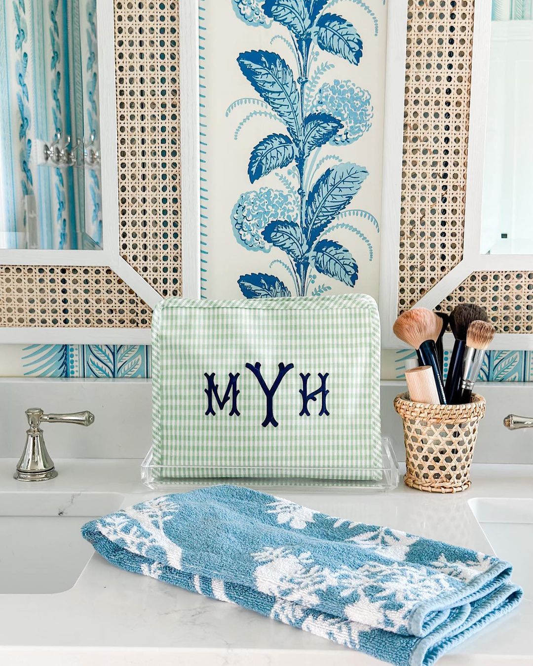 Green gingham pouch with 'MYH' monogram embroidered in navy.